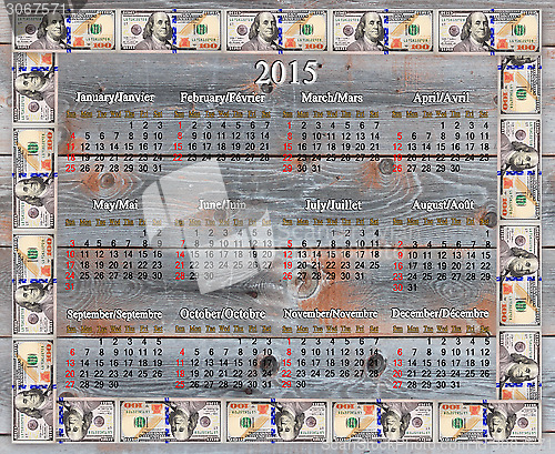 Image of calendar for 2015 in the dollars' frame on board
