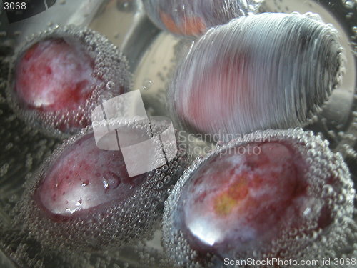 Image of  plums in the mineral water