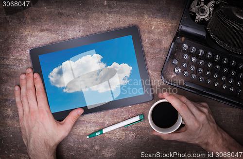 Image of Cloud-computing connection on a digital tablet pc