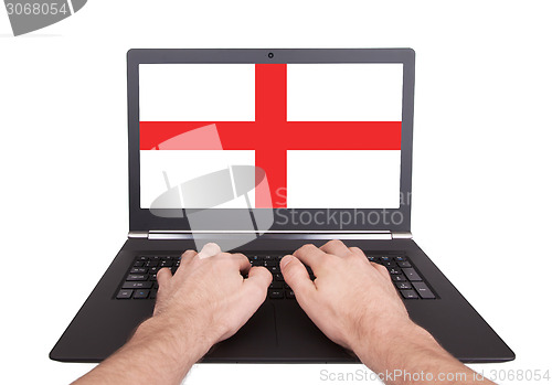 Image of Hands working on laptop, England
