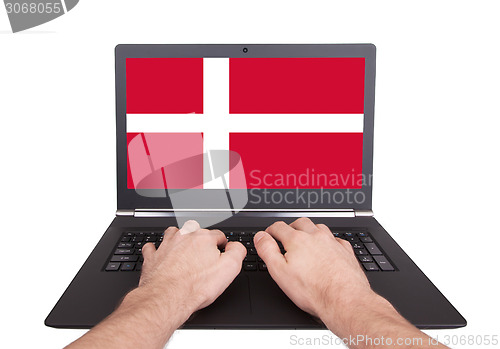 Image of Hands working on laptop, Denmark