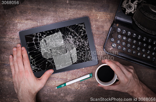 Image of Tablet computer with broken glass