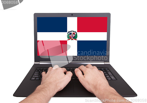 Image of Hands working on laptop, Dominican Republic