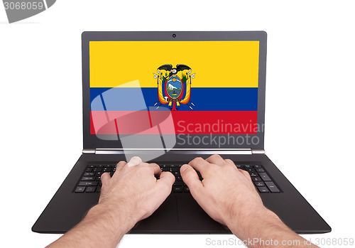 Image of Hands working on laptop, Ecuador