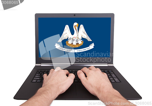 Image of Hands working on laptop, Louisiana