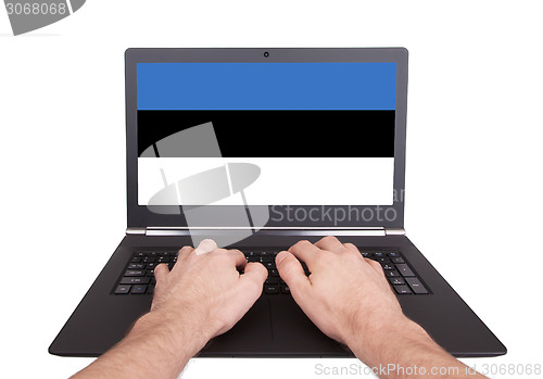 Image of Hands working on laptop, Estonia