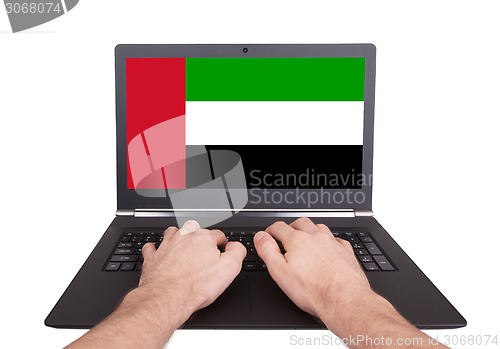 Image of Hands working on laptop, UAE