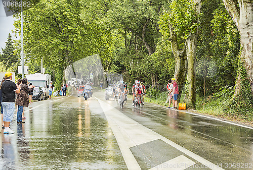 Image of Group of Cyclists in a Rainy Day