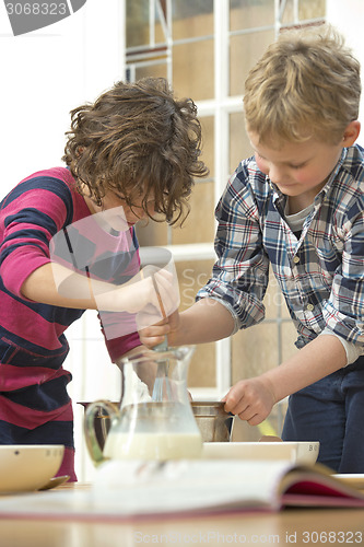 Image of Kids whisking batter