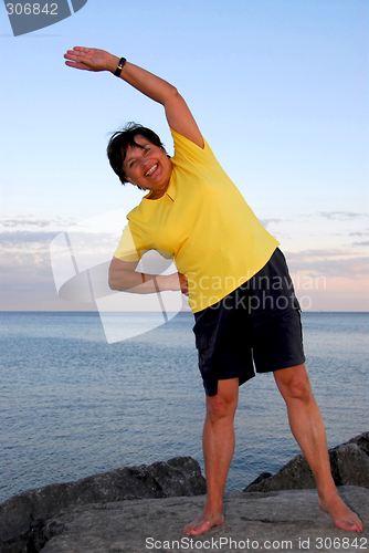 Image of Mature woman exercising