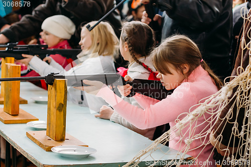 Image of Unrecognizable Belarusian secondary school pupils girl shooting