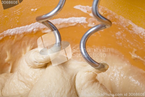 Image of Kneading a dough with a machine 