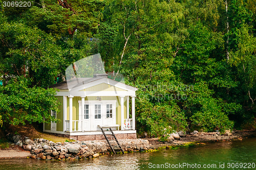 Image of Yellow Finnish Wooden Bath Sauna Log Cabin On Island In Summer