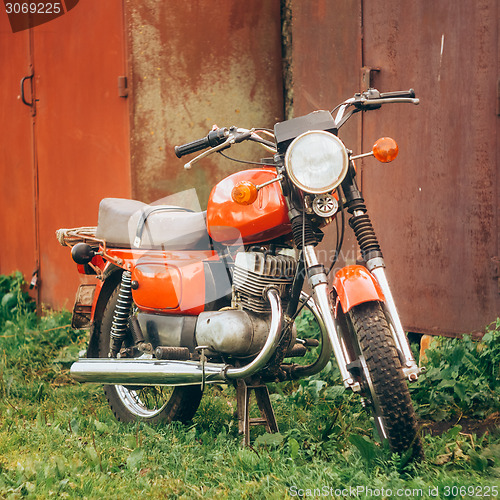 Image of Vintage Red Motorcycle Generic Motorbike In Countryside