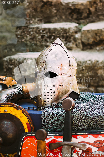 Image of Protective helmet with a visor on medieval knight