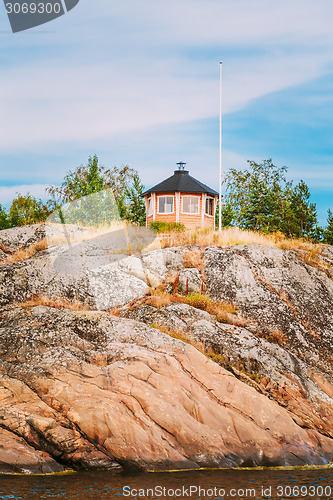 Image of Yellow Finnish Lookout Wooden House On Island In Summer