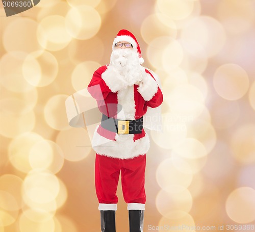 Image of man in costume of santa claus with bag