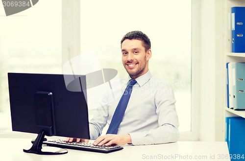 Image of smiling businessman or student with computer