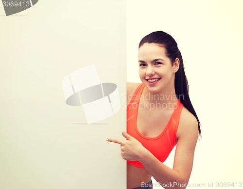 Image of teenage girl in sportswear with white board