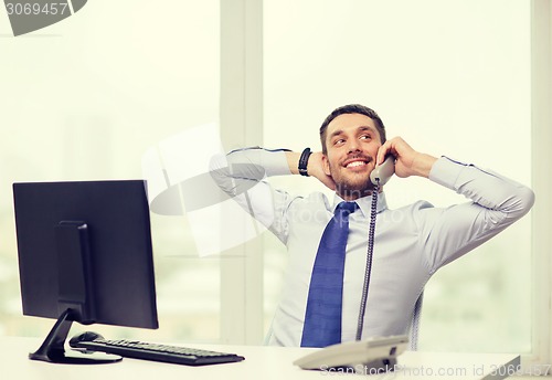 Image of smiling businessman or student with computer