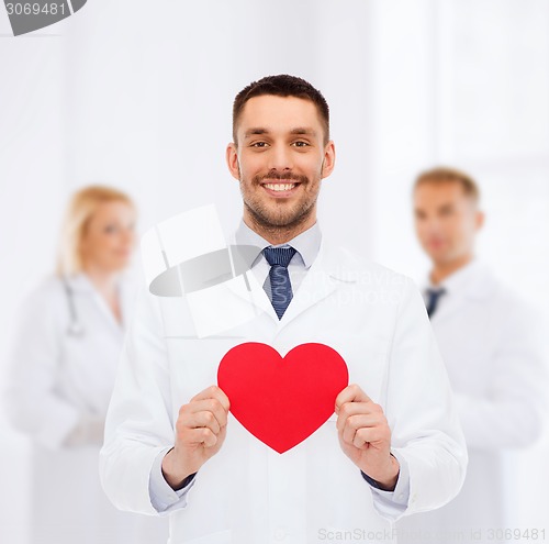 Image of smiling male doctor with red heart