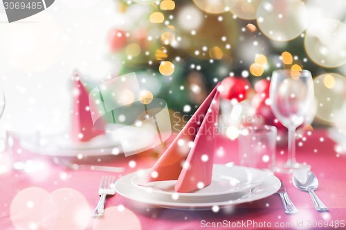 Image of room with christmas tree and decorated table