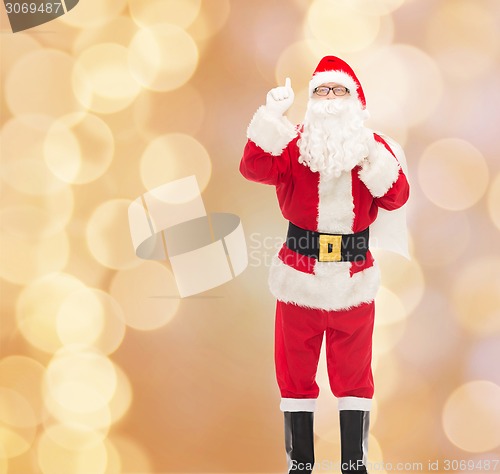 Image of man in costume of santa claus with bag