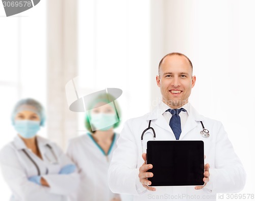 Image of smiling male doctor with stethoscope and tablet pc