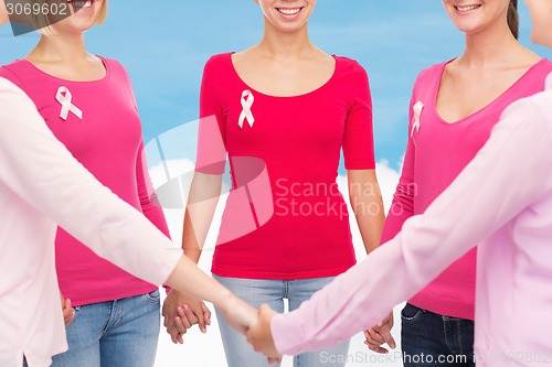 Image of close up of women with cancer awareness ribbons