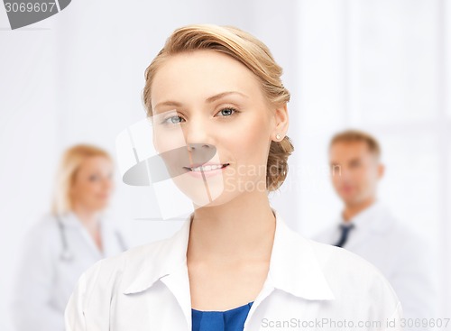 Image of smiling young female doctor in hospital