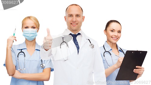 Image of group of smiling doctors with showing thumbs up