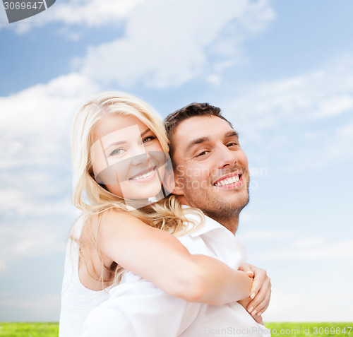 Image of happy couple having fun over poppy flowers field