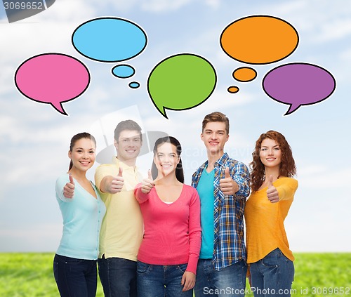 Image of group of smiling teenagers showing thumbs up
