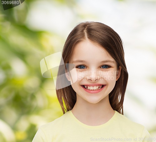 Image of smiling little girl over white background