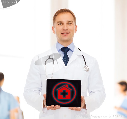 Image of smiling male doctor with stethoscope and tablet pc