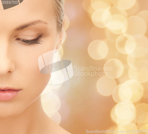 Image of beautiful young woman half face