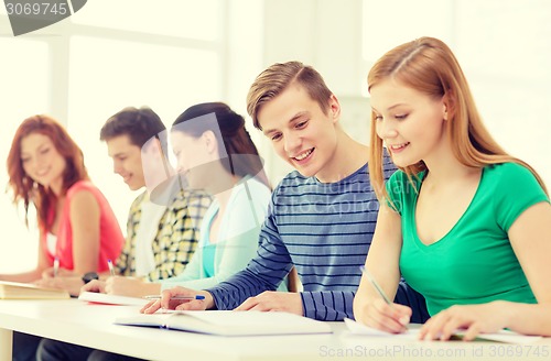 Image of students with textbooks and books at school