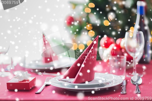 Image of room with christmas tree and decorated table