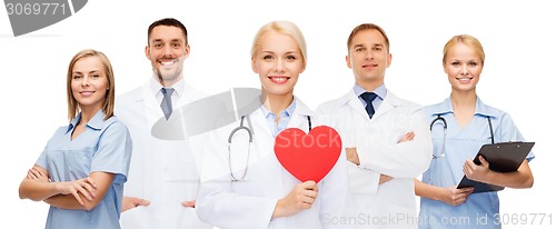 Image of group of smiling doctors with red heart shape