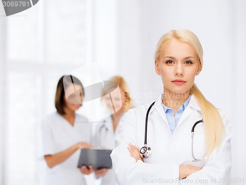 Image of serious female doctor with stethoscope