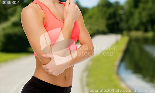 Image of sporty woman with pain in elbow