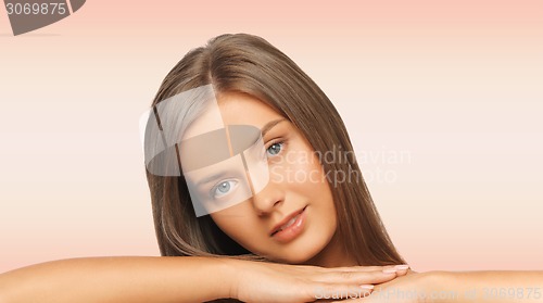 Image of beautiful young woman with bare shoulders