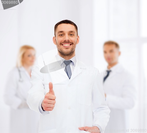 Image of smiling male doctor showing thumbs up