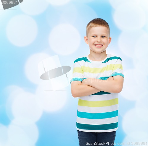 Image of little boy in casual clothes with arms crossed
