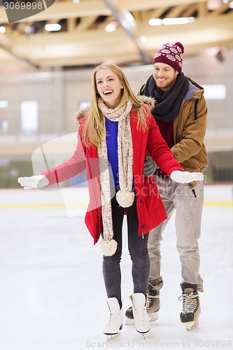 Image of happy couple on skating rink