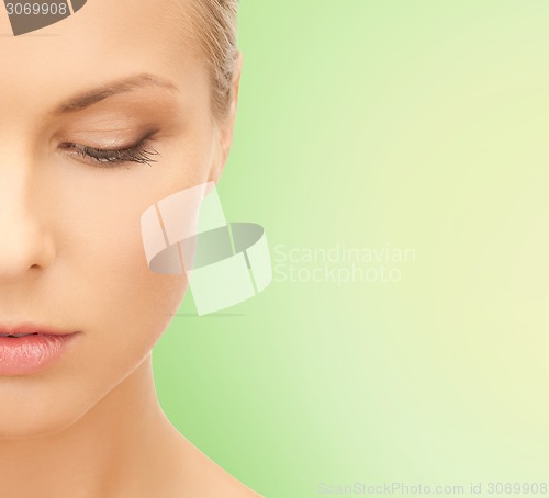 Image of beautiful young woman half face