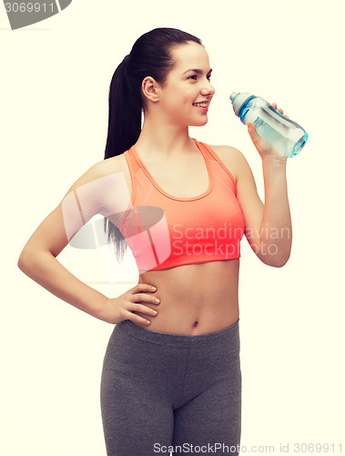 Image of sporty woman with water bottle