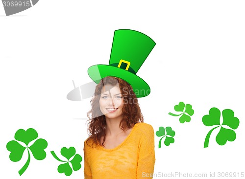 Image of smiling teen girl in green top hat with shamrock