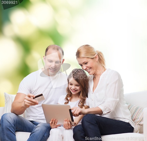 Image of happy family with tablet pc and credit card