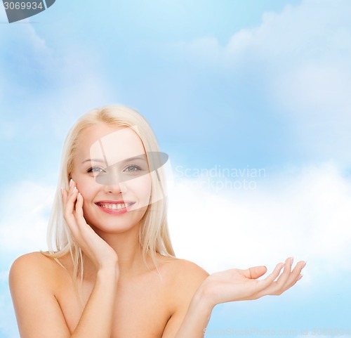 Image of smiling woman holding imaginary lotion jar